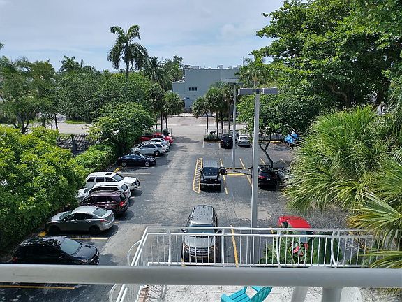 parking area view from top floor stairway - no guest parking - one assigned spot with unit