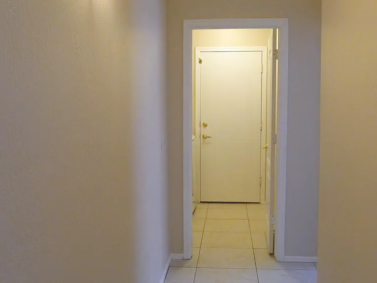 Hallway leading to laundry and garage.