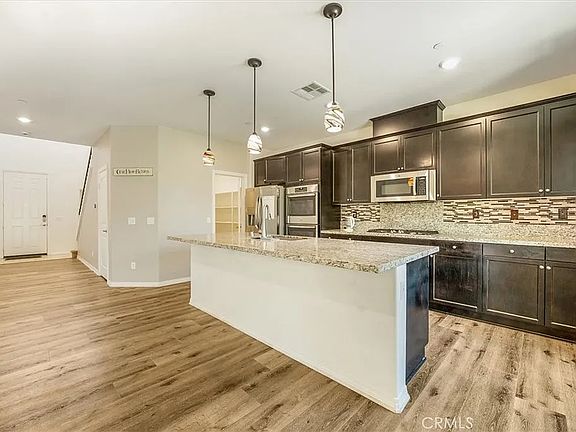 Kitchen looking toward entryway