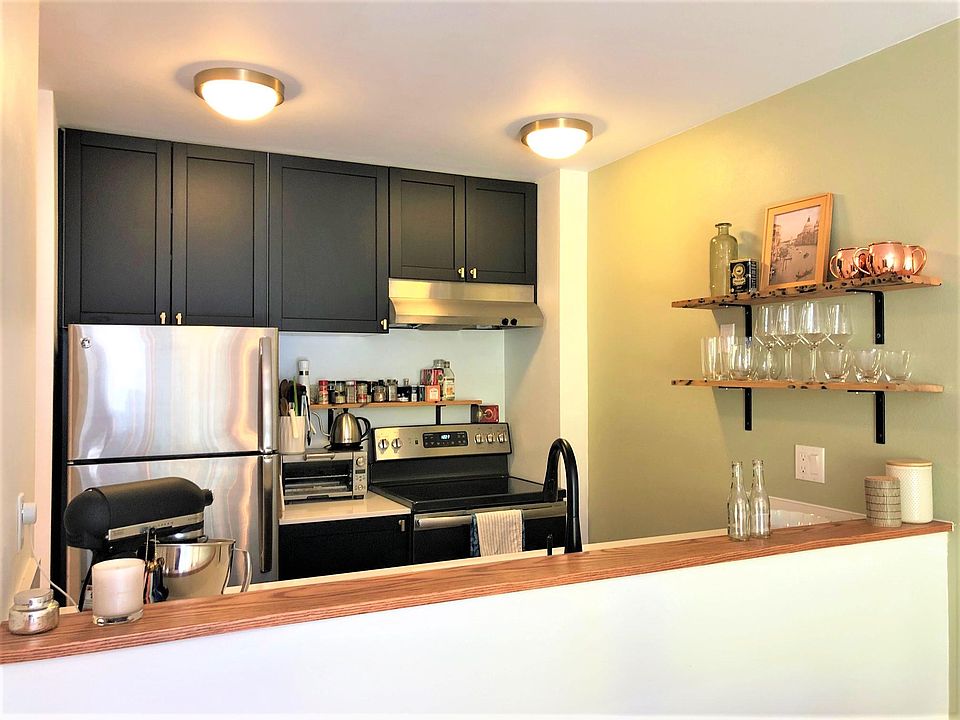 Remodeled kitchen with dishwasher and ample storage.