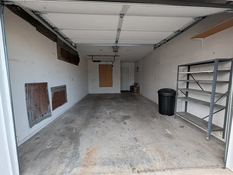 One car garage, but there is also a shed in the back yard where you can store lawn mower, etc.