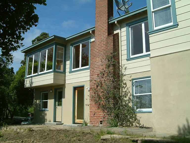 Back of house with lower entrance