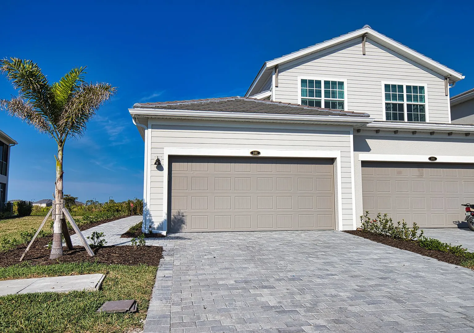 Golf Transfer New Construction 3-Bedroom 2-Bathroom First Floor Coach Home in the desirable Welle... — Photo 1