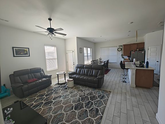 the modern kitchen and spacious living area