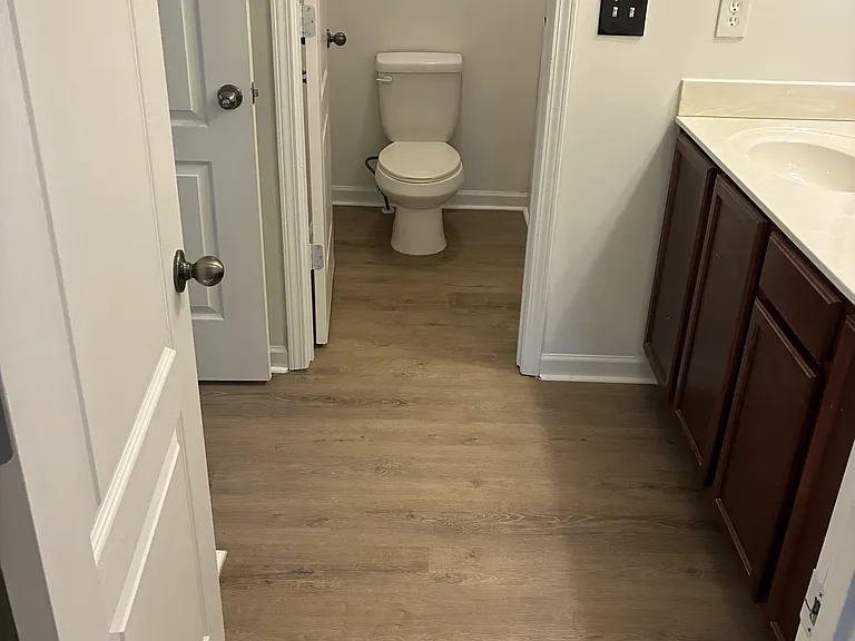 Second bathroom is designed with separate wet and dry zones