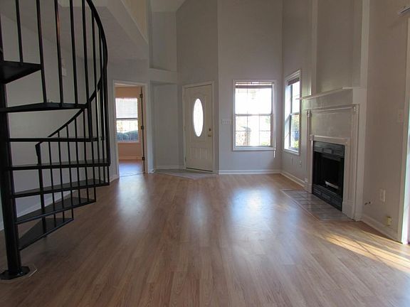 High ceilings and plenty of natural light (background room is the master bedroom).