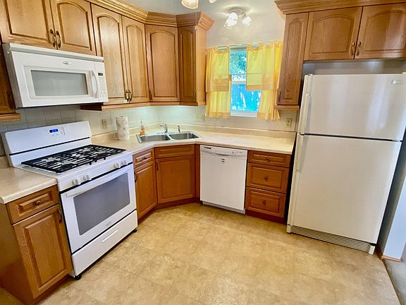 Kitchen with beautiful wood cabinetry and all appliances included.
