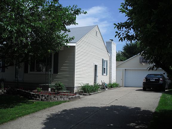 Tons of parking! Side by side driveway and huge garage.