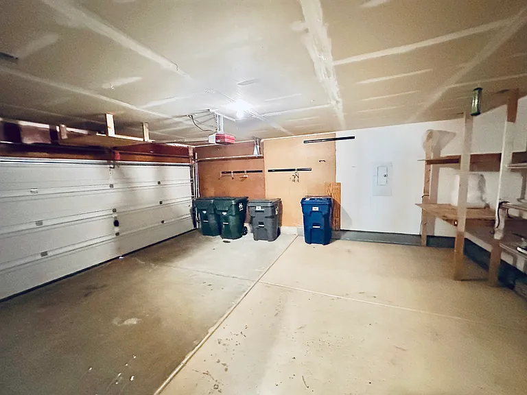 Garage space with built-in storage shelf
