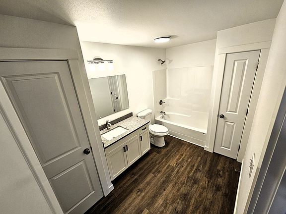 Spacious bathroom with ample storage.