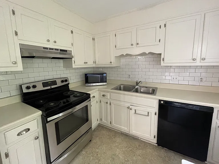 Bright charming kitchen - nice to cook in. All appliances provided - including microwave, dishwasher, garbage disposal, fridge and full sized washer & dryer