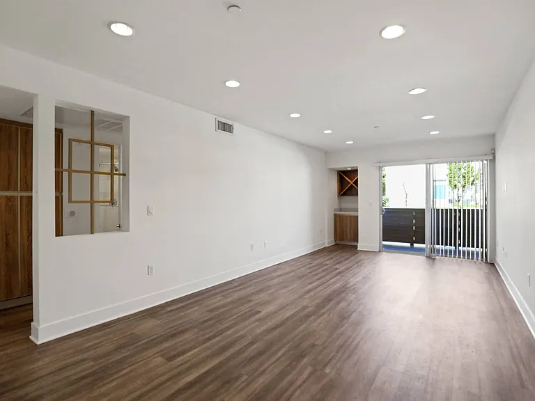 Open-Concept Dining and Living Room Space with Patio