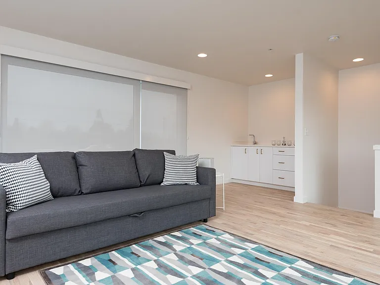 Fourth floor Family Room (or 5th Bedroom) with fireplace, balcony and wet-bar