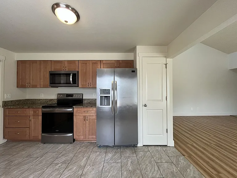 Bright and Airy Home with Stainless Steel Kitchen, Vaulted Ceilings & Washer + Dryer — Photo 23