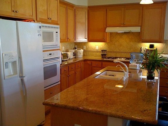 Granite kitchen countertops and light maple cabinets
