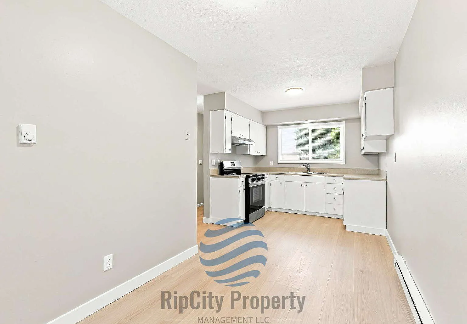 Updated 2-Bedroom Corner Apartment with Private Fenced Yard and Parking — Photo 3