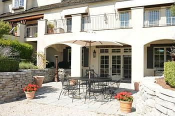 This walkout lower level opens onto a patio made of Georgia blue stone. The steps lead to the upper level deck. Both very accessible to main rooms of the house for ease when entertaining. Hi-tech sound system can also be enjoyed while outdoors.