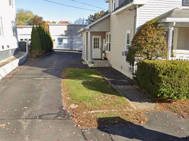 Side entry and garage view
