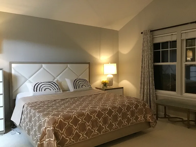 Master bedroom with 2 walk-in closets, blackout window treatments