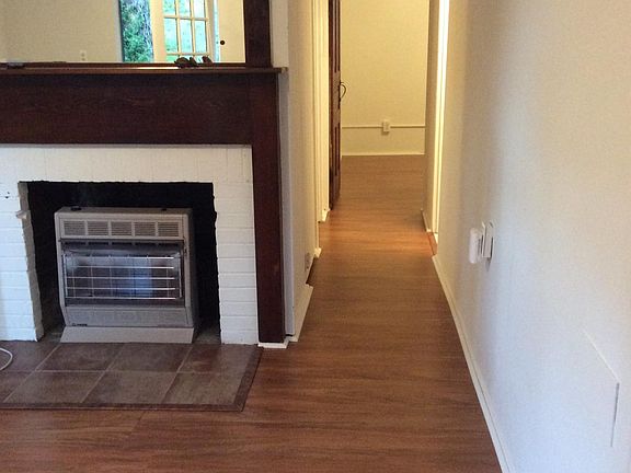 Living room with hallway to bedrooms and bathroom