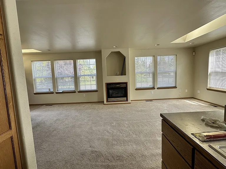 Great room - looking at fireplace from kitchen