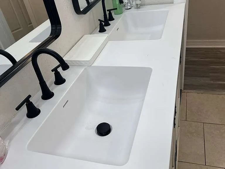 Crisp white sink with matte black fixtures