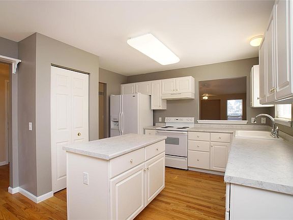 Freshly painted, new counter tops pull out drawers in center island!