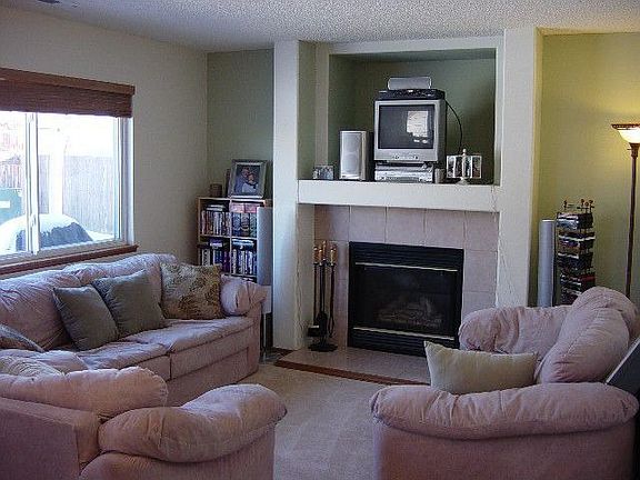 Family Room with Gas Log Fireplace and walkout to patio.