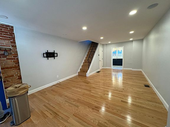 Living room from front of house. TV mount available for use during rental.