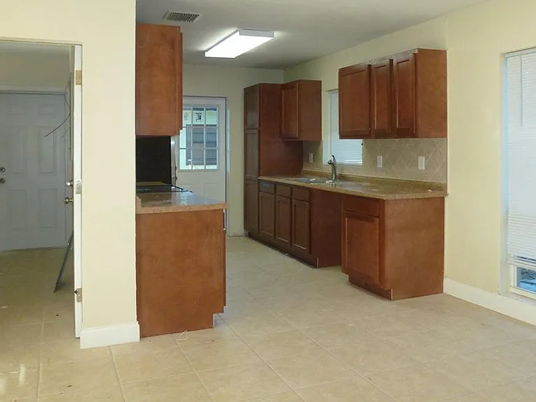 Galley kitchen with stainless steel appliances