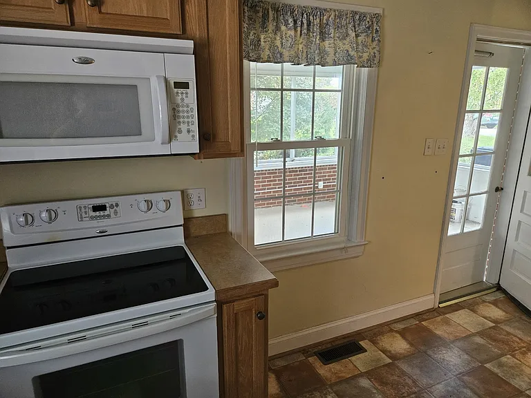 Screened in porch right off the kitchen