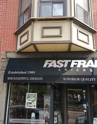 Front of building, business (Fast Frame) on the 1st floor is
