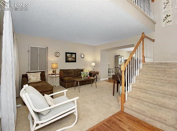 Step into the hardwood entry with vaulted ceilings and open concept living.