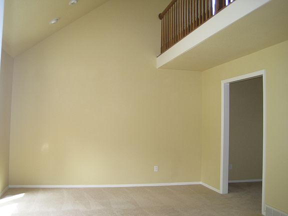 Living room with loft above