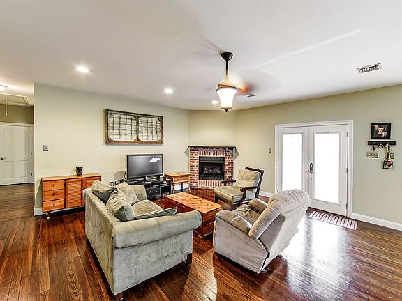 Den with wood floors 