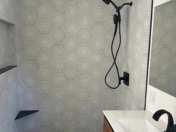 Double handheld shower head.