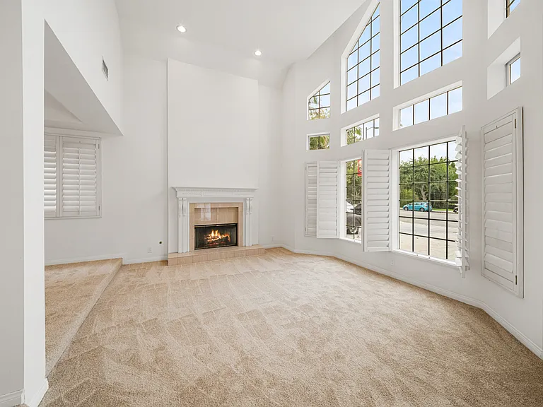 Grand Formal Living Room with Large Scale Windows