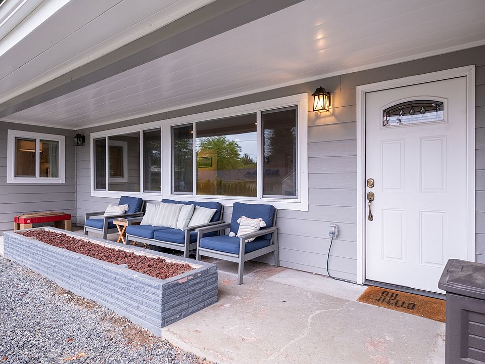 Relax on the cozy front porch in a scenic, peaceful neighborhood.