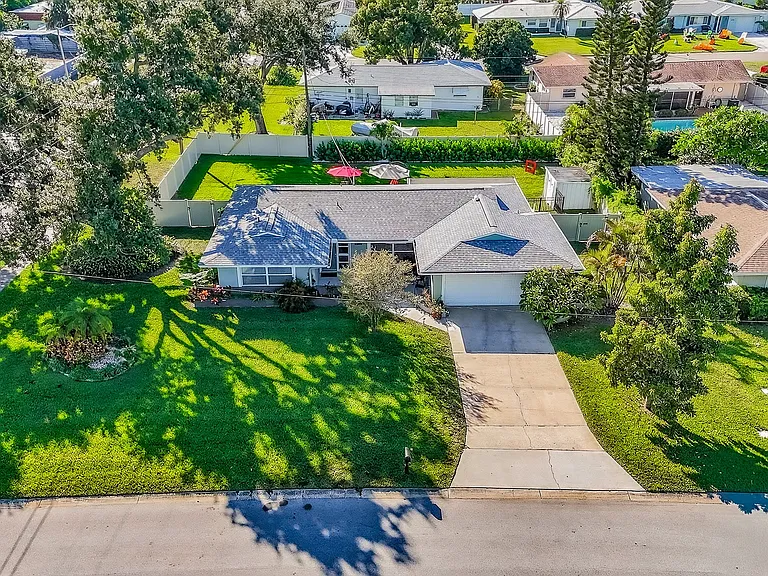 Fully fenced in back yard with storage shed.