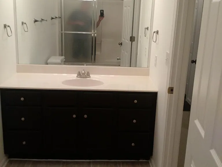 The large master bathroom has more than enough room for two