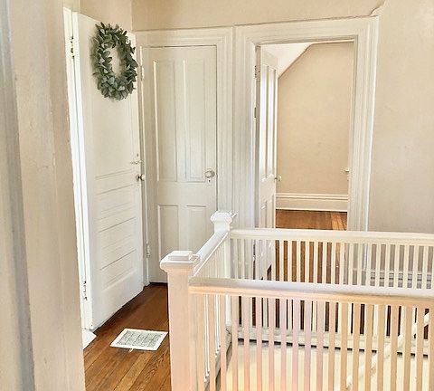 Upstairs, there's a railway around the staircase, and this photo looks toward Bedroom #1