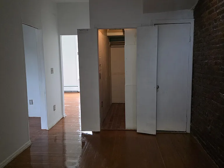 Large walk in closet. Living room door is to the back. Bedroom door to the left.
