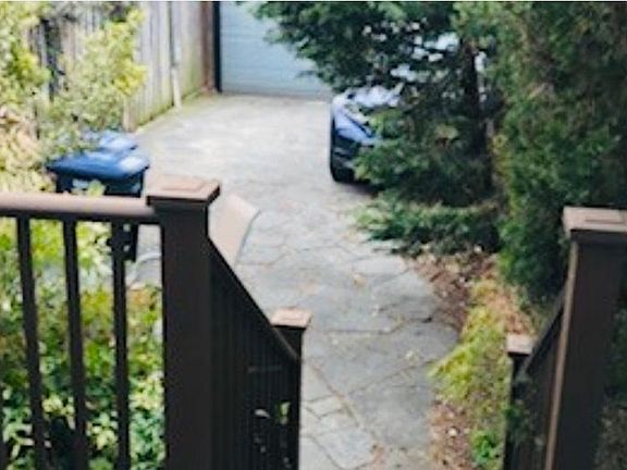 Deck, flagstone patio, shed and off street secured parking for 2 cars