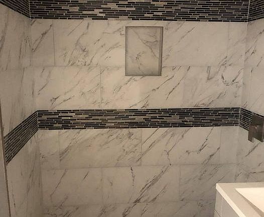 Walk-in shower with porcelain tile