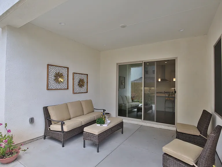 Covered California room offers usable outdoor space, day & night