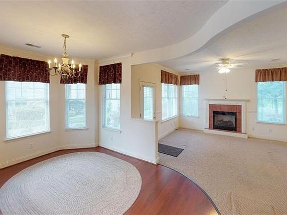 16 x 11 Dining room with bay of windows.  Laminate flooring.  Open to kitchen and living room