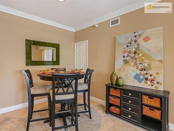 The cheerful dining area has a huge coat and storage closet in the corner.