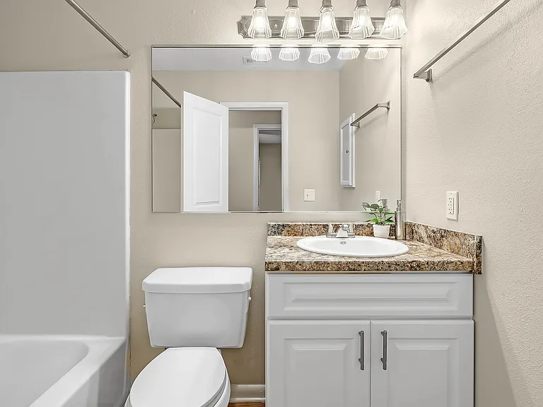 Our elegant bathrooms are equipped with large mirrors, abundant vanity lighting, and convenient medicine cabinets.