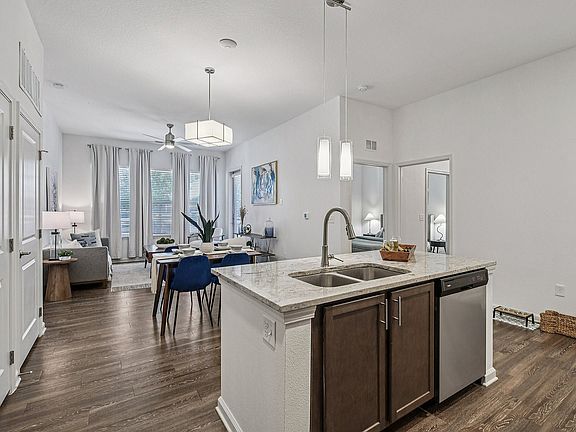 Experience modern living in this airy, sunlit space with sleek design features.