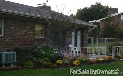 back of house with patio